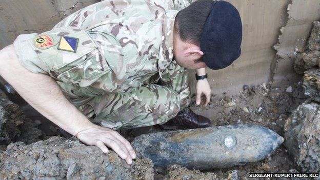 A bomb disposal expert inspects the 50kg device