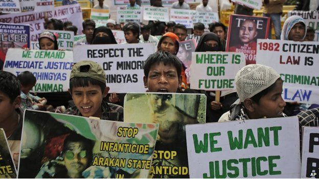 Rohingya refugees living in India hold placards during a protest demanding an end to the violence against ethnic Rohingyas in Myanmar