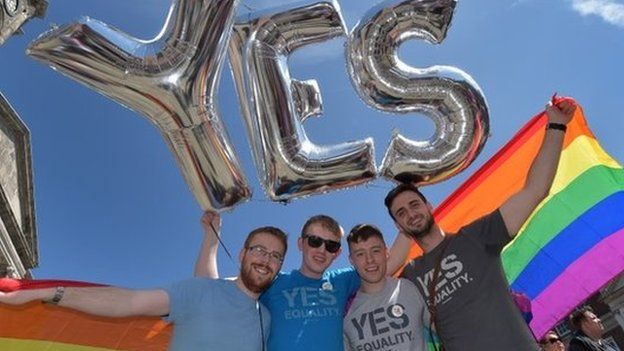 Supporters in favour of same-sex marriage pose for a photograph as thousands gather in Dublin Castle square awaiting the referendum vote outcome on May 23, 2015 in Dublin, Ireland