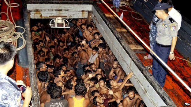 Myanmar's navy with a boat said to contain mainly Bangladeshi migrants, 22 May