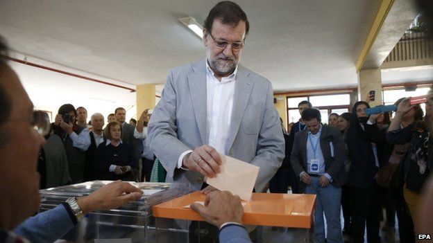 Spanish Prime Minister, Mariano Rajoy, casts his vote at a polling station in Aravaca, Madrid, Spain, 24 May 2015