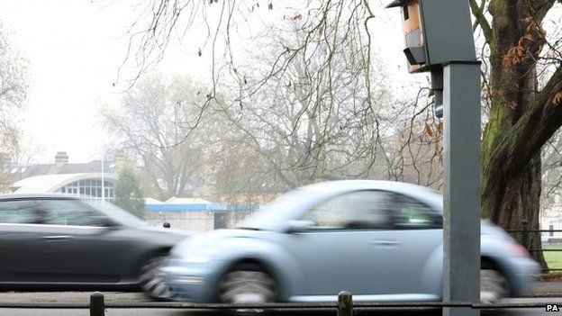 Cars passing fixed speed camera