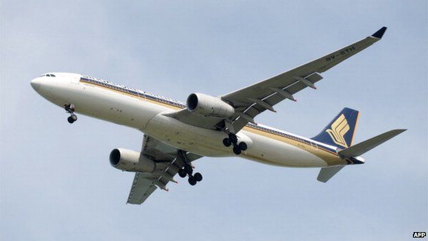 This photograph taken on 4 May 2014 shows a Singapore Airlines (SIA) aircraft approaching Changi International Airport in Singapore