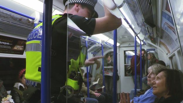 Police officer on the Tube