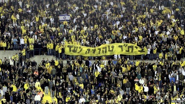 Beitar Jerusalem supporters hold up a banner saying "Beitar Pure Forever" at Teddy Stadium in Jerusalem (26 January 2013)