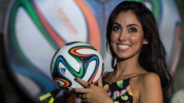 A model holds the Brazuca - the official ball for the Brazil 2014 FIFA World Cu