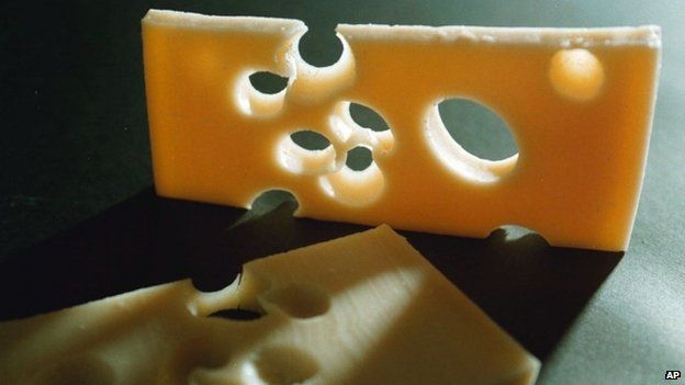 This undated file photo shows two slices of the famed Swiss Emmental cheese.