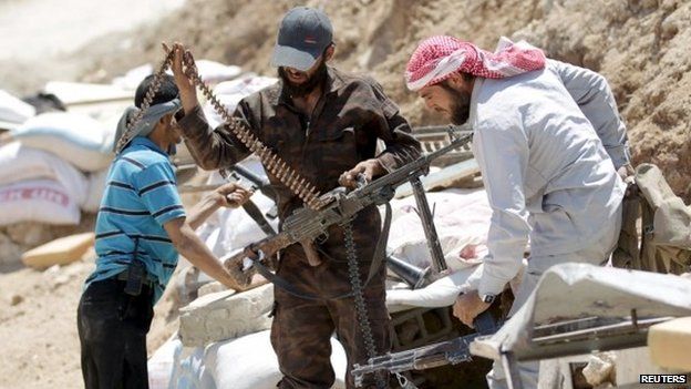 Rebel fighters from the Ahrar al-Sham Islamic Movement prepare their weapons in Jabal al-Arbaeen, which overlooks the northern town of Ariha, one of the last government strongholds in the Idlib province May 26, 2015.