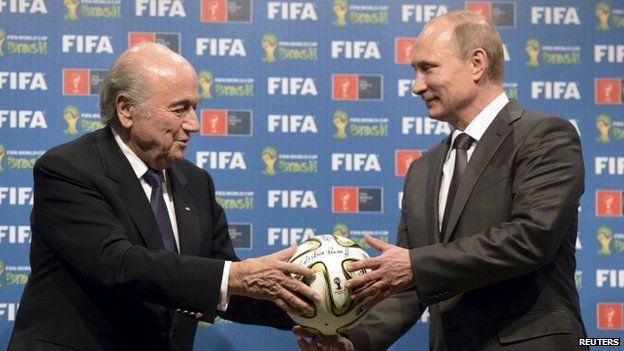 Russia"s President Vladimir Putin (R) and FIFA President Sepp Blatter take part in the official handover ceremony for the 2018 World Cup scheduled to take place in Russia, in this file picture taken in Rio de Janeiro, Brazil, July 13, 2014.