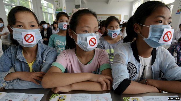 Students wearing masks with no smoking signs attend an anti-smoking lecture ahead of the World No Tobacco Day, at a middle school in Fuyang, Anhui province, China, May 29, 2015. World No Tobacco Day falls on May 31 every year. 29 May 2015.