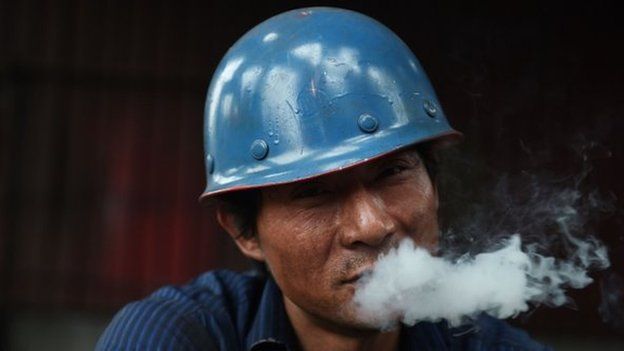 Construction worker smokes 28 May 2015