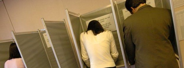 People casting a vote at an election