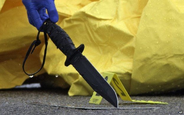 Police pick up knife at crime scene