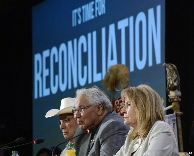 Commission chairman Justice Murray Sinclair (C) and fellow commissioners Marie Wilson (R) and Wilton Littlechild discuss the commissions report on Canada's residential school system at the Truth and Reconciliation Commission on 2 June.