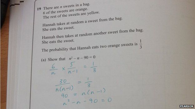 A GCSE maths paper - with answer written beneath question