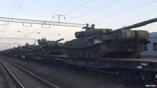 Tanks are seen on a freight train shortly after its arrival at a railway station in the Russian southern town of Matveev Kurgan, near the Russian-Ukrainian border in Rostov region, on 26 May 2015.