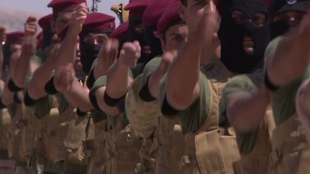 Sunni Arabs, Shia Arabs and Kurds march in step at a parade ground in northern Iraq