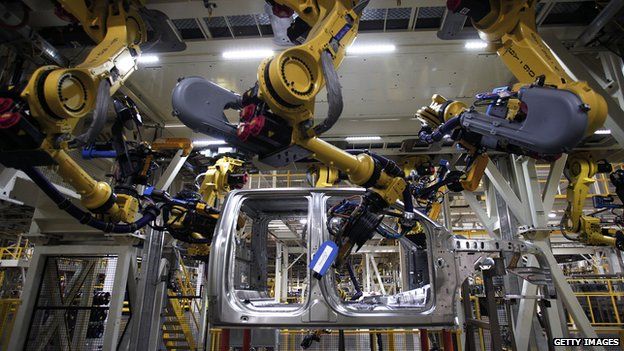 Robotic arms on factory line in Ford truck plant
