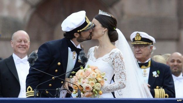 Sweden's Princess Sofia (right) and Sweden's Prince Carl Philip kiss after their wedding ceremony at Stockholm Palace (13 June 2015)