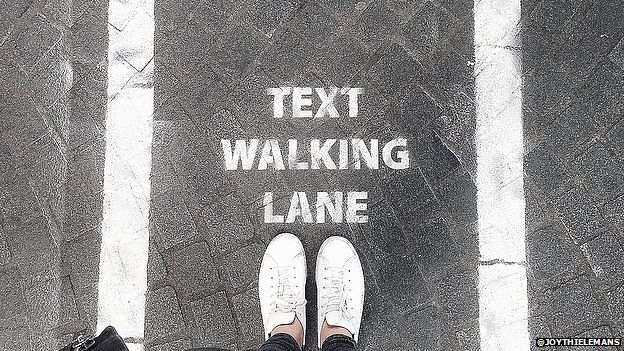 'Text walking lanes': Antwerp sets up temporary scheme - BBC News