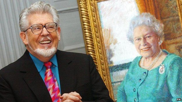 Rolf harris with his portrait of the Queen