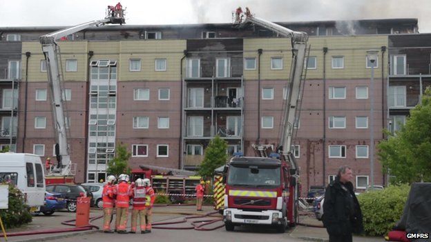 Wigan flats fire: Sixty homes destroyed in blaze - BBC News