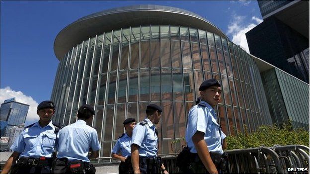 Policemen patrol outside the Legislative Council building in Hong Kong