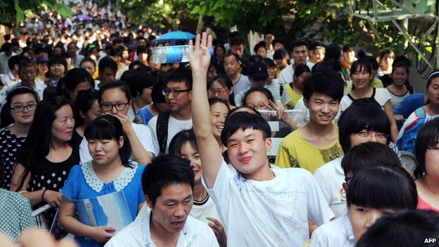High school students walk out of a school after sitting the 2015 national college entrance examination