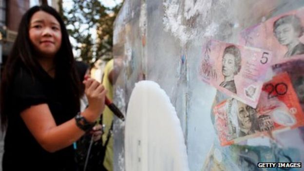 Australian banknotes frozen in ice