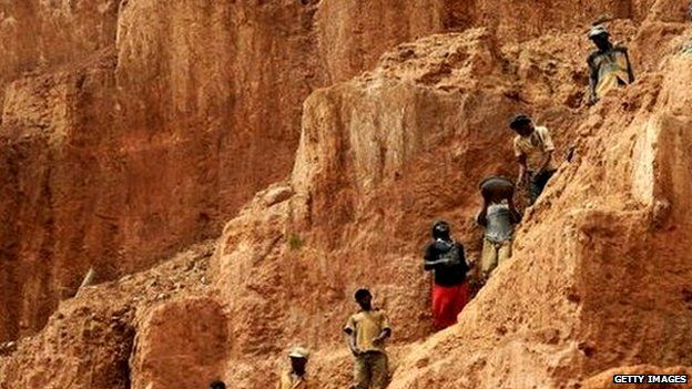 Workers up a mountain in the DR Congo