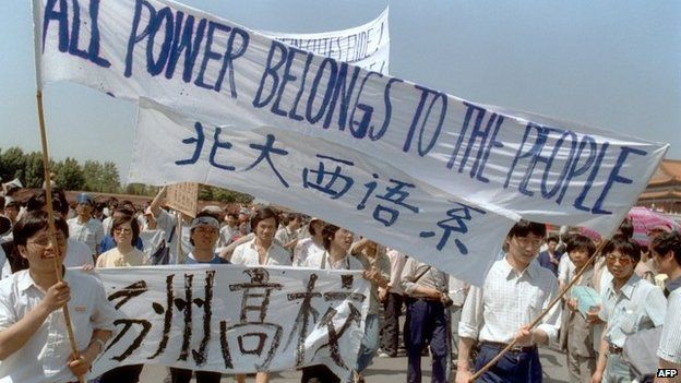 Waving banners, high school students march in Beijing streets near Tiananmen Square on 25 May 1989 during a rally to support the pro-democracy protest against the Chinese government