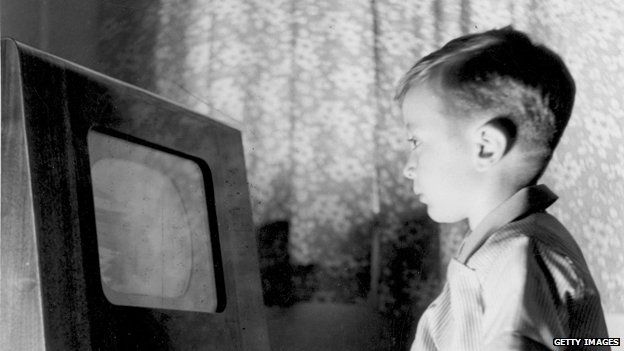 1950s boy stares at TV