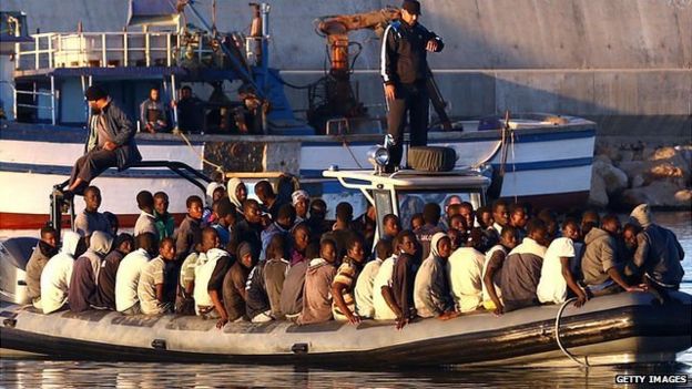 African migrants rescued by the Libyan coastguard after their inflatable boat started to sink off the coastal town of Guarabouli, 60 km east of Tripoli, 20 November, 2014