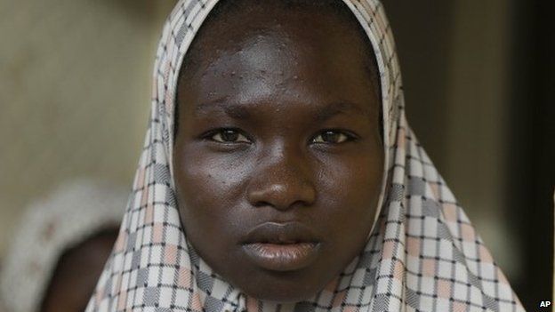 Salamatu Bulama, a lady who says that Islamist exremists stoned her and others before she was rescued by Nigerian soldiers, as she sits in a clinic at a camp in Yola, Nigeria Sunday, 3 May 2015.