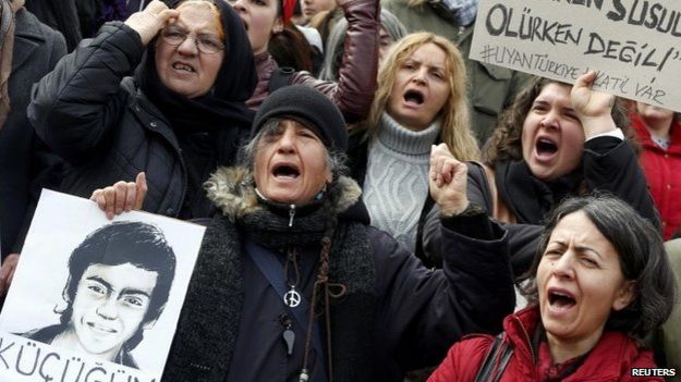 Anti-government protesters shout slogans during a demonstration marking the funeral of Berkin Elvan