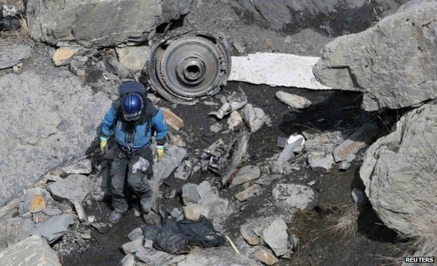 French rescue worker inspects debris near Seyne-les-Alpes