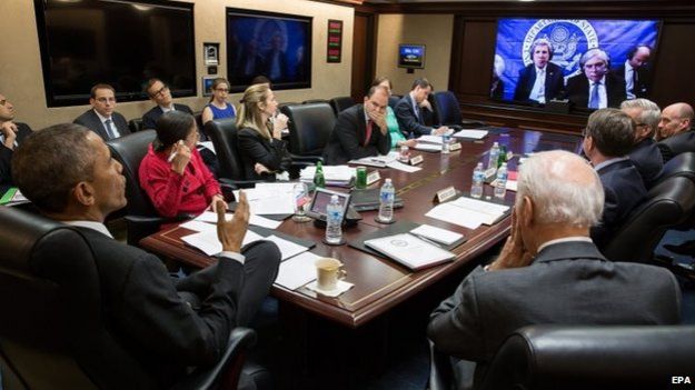 A handout picture released by the White House on 1 April 2015 shows US President Barack Obama (L) and Vice President Joe Biden (R), with the national security team, participate in a secure video teleconference from the Situation Room of the White House in Washington.