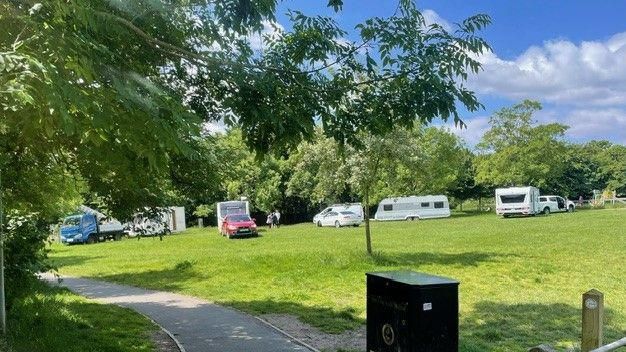 A photo shows four caravans, as well as a number of other vehicles including cars and vans parked up on Horfield Common