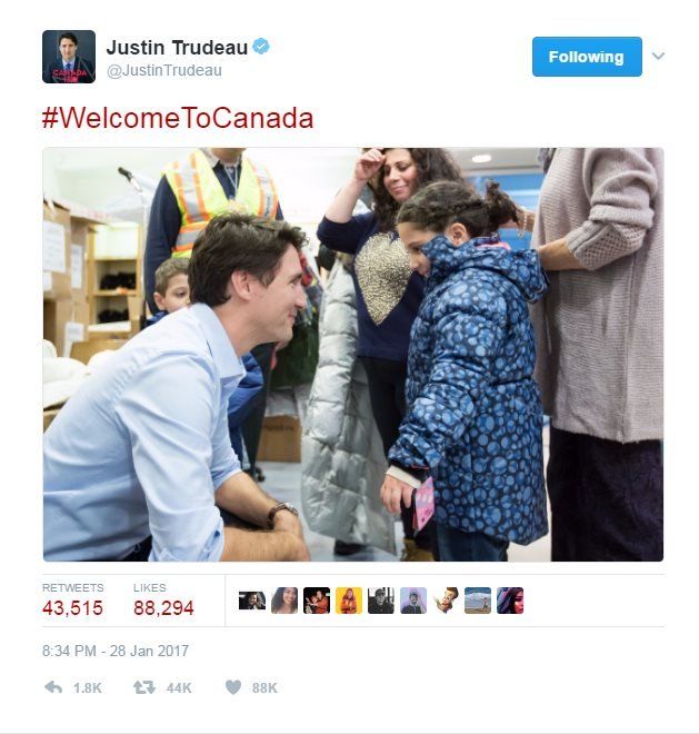Tweet reads: "welcome to Canada" alongside photo of Mr Trudeau smiling at young girl refugee