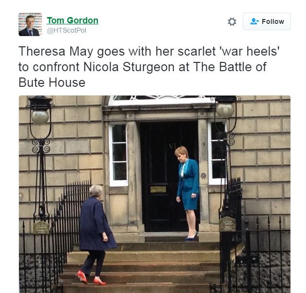 Tweet by Tom Gordon reads- "Theresa May goes with her scarlet "war heels" to confront Nicola Sturgeon at the battle of bute house"