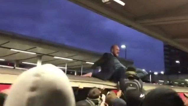 Protester being dragged from train