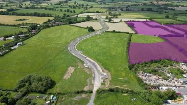 Aerial view of site, Ham Farm highlighted in purple