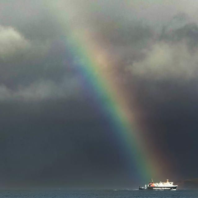 Ferry at end of a rainbow