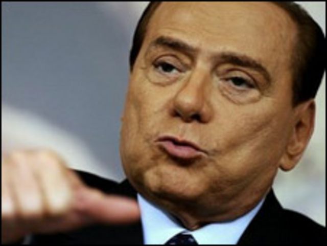 Имя берлускони 7 букв. Сильвио Берлускони. Сильвио Берлускони крестный отец. Лозунг Берлускони. Часы Берлускони.