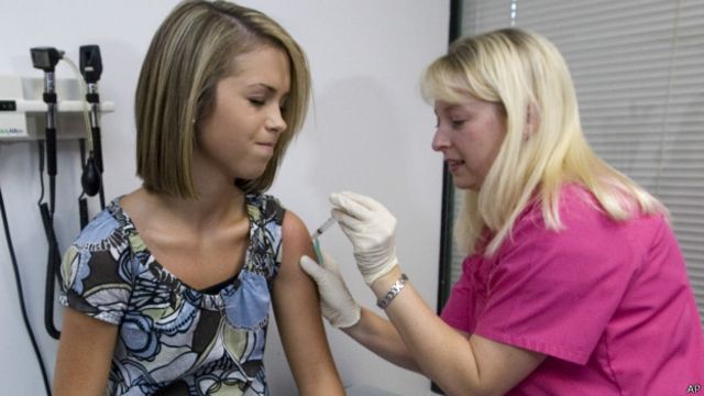 Girl getting vaccinated.