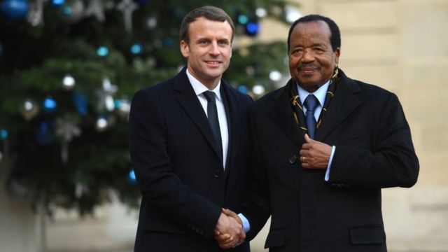 President Biya of Cameroon and French president Emmanuel Macron dey shake hand.