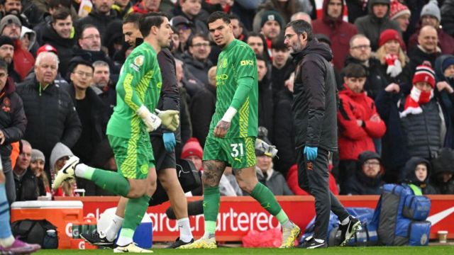 Ederson of Manchester City looks dejected leaving the pitch after sustaining an injury as teammate Stefan Ortega is substituted on