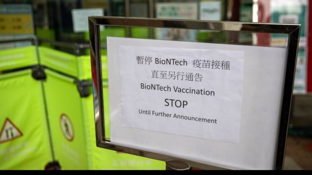 A sign announces the suspension of BioNTech vaccinations at a community vaccination center, in Hong Kong, China, 24 March 2021