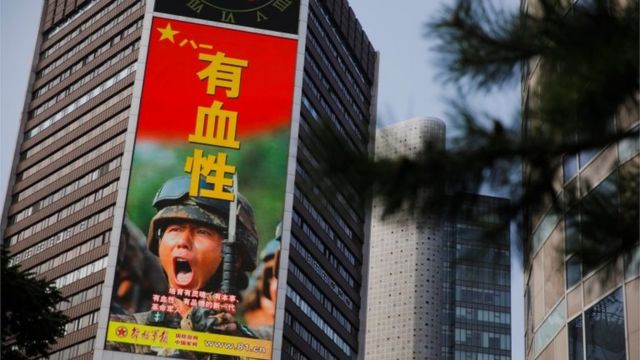 A military advertisement marking the 95th founding anniversary of the People"s Liberation Army (PLA) is displayed at an office building in Beijing, China, 19 August 2023.