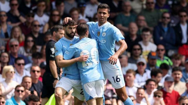 Manchester City players celebrate against Fulham